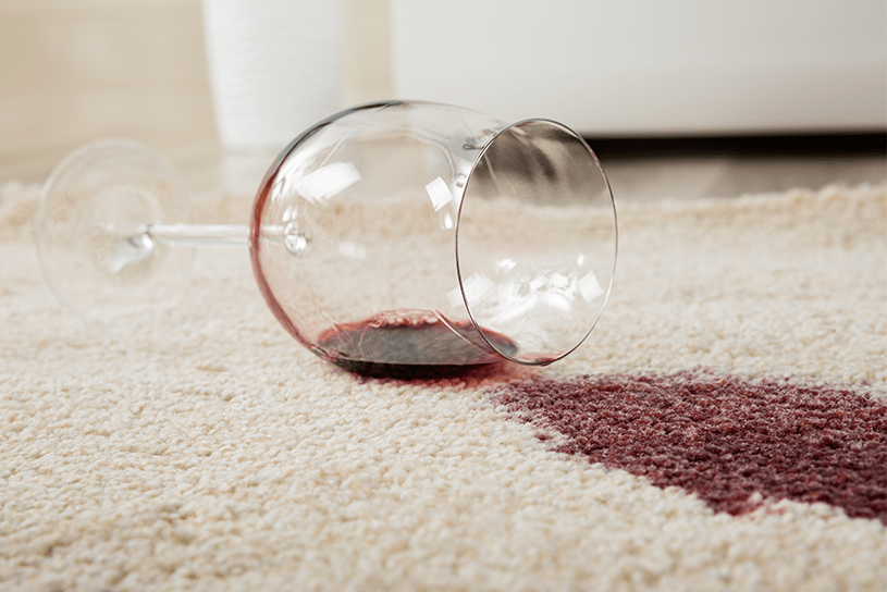 Red wine spill on a carpet in a rental property