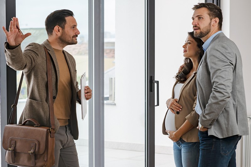 Landlord showing tenants around a property