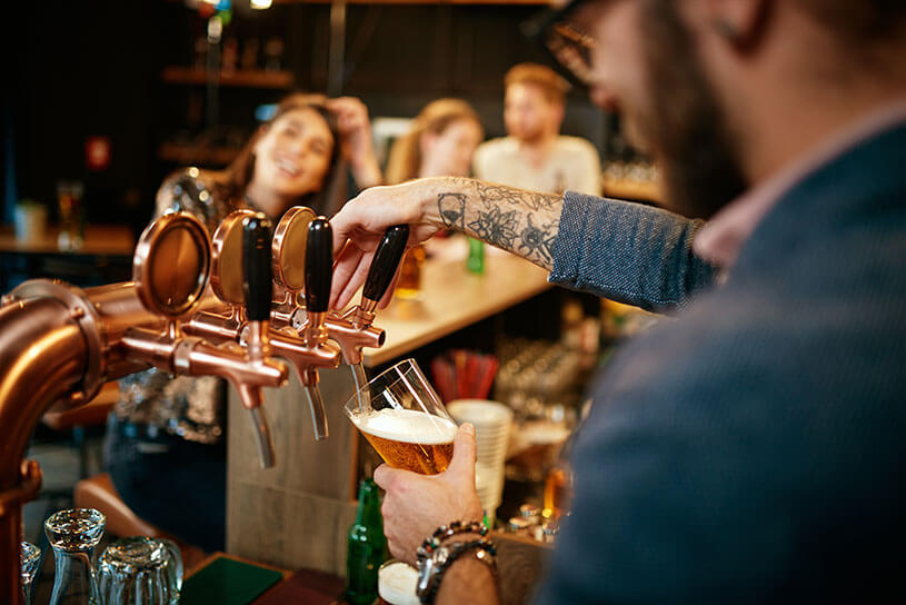 Pub landlord pouring a pint