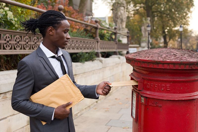 Businessman posting a letter