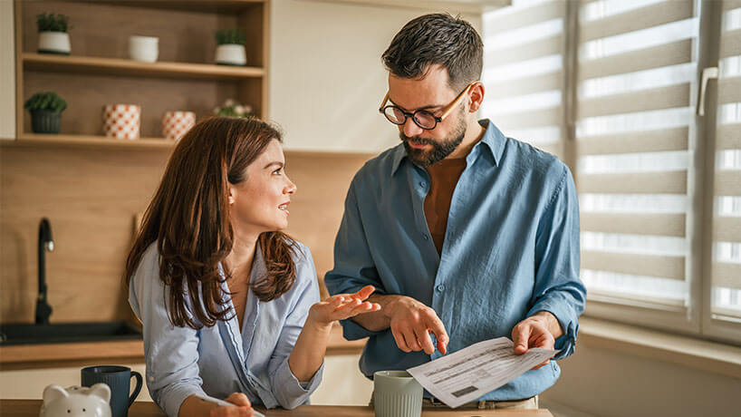 Couple discussing household finance and mortgage