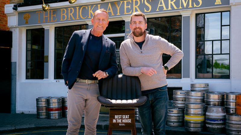 Footballer Ray Parlour stands with landlord of London pub The Bricklayer's Arms