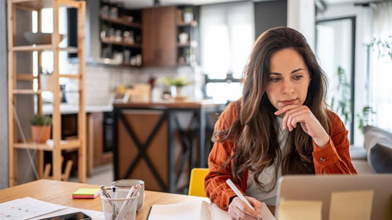 Focused freelancer working on invoices